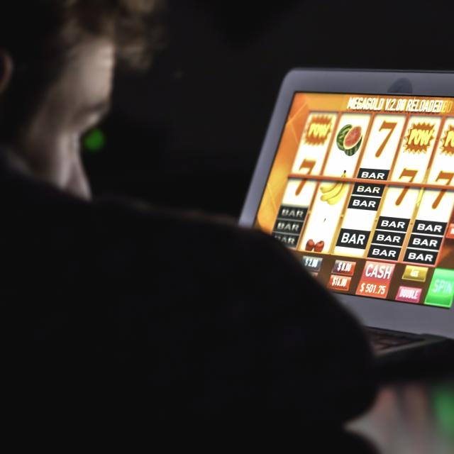 Man staring at online fruit machine